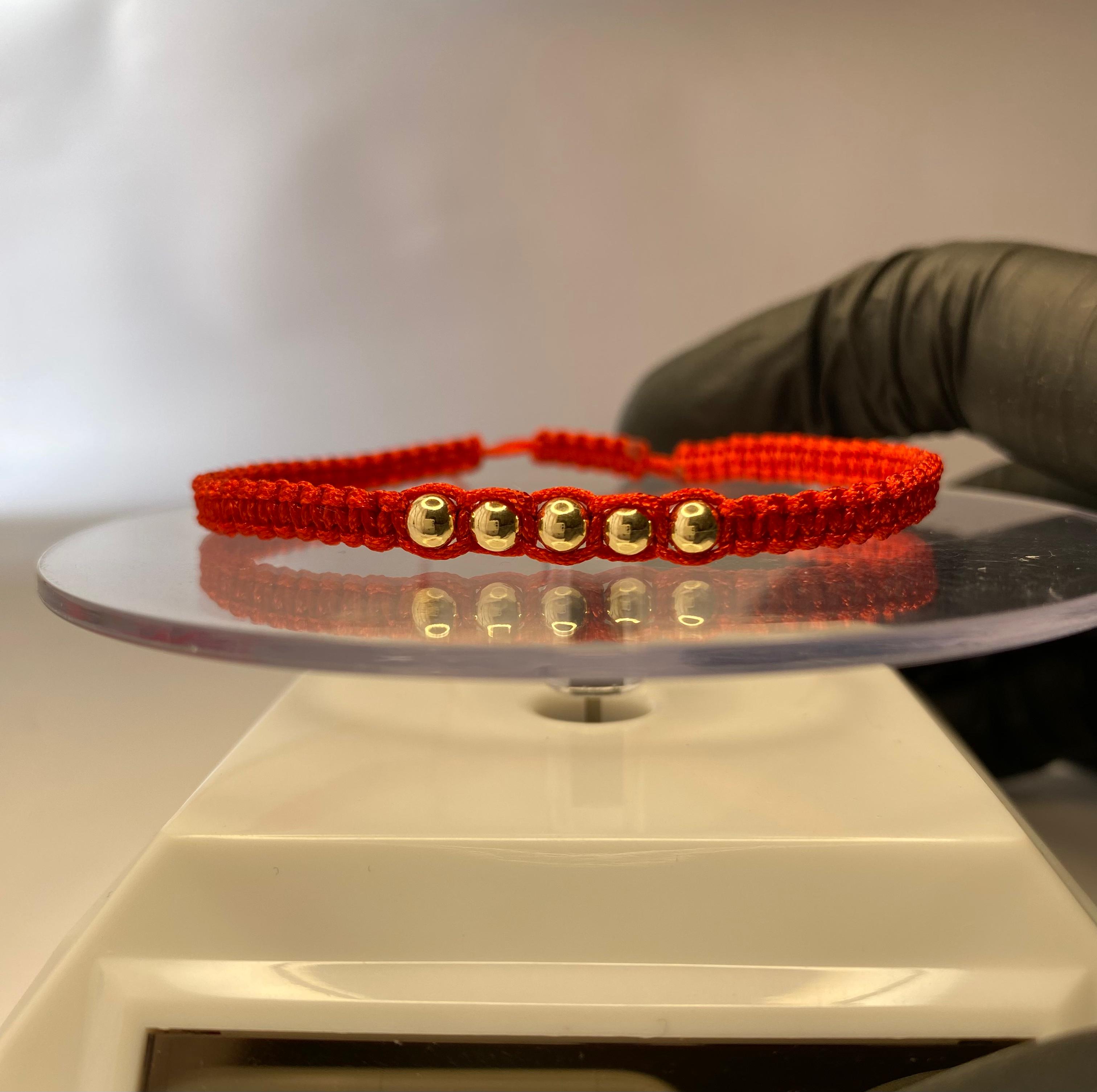 Pulsera hilo rojo con 7 balines de oro 18k ajustable mujer