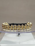 Pulsera hilo negro con balines de oro 18k ajustable hombre